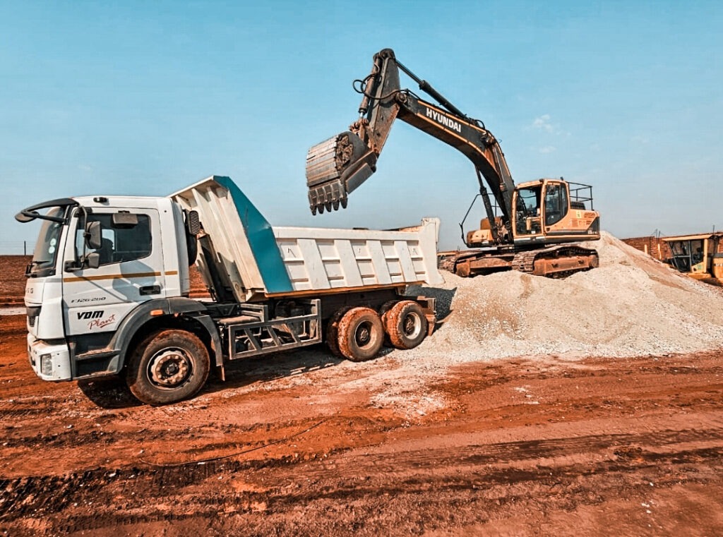 Excavator loading Sand to Tipper Truck